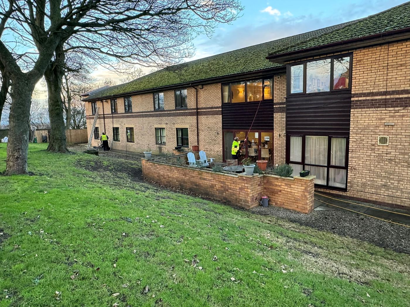 Two PropertyKleen cleaners working on a care home