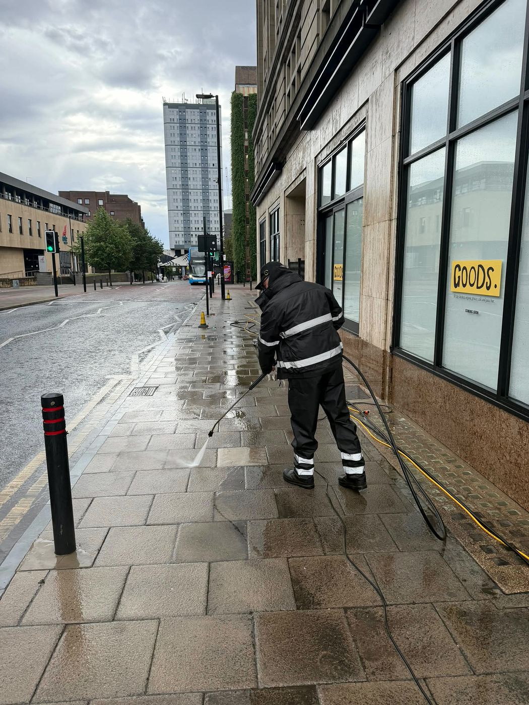 PropertyKleen operative jet washing a city-centre pavement