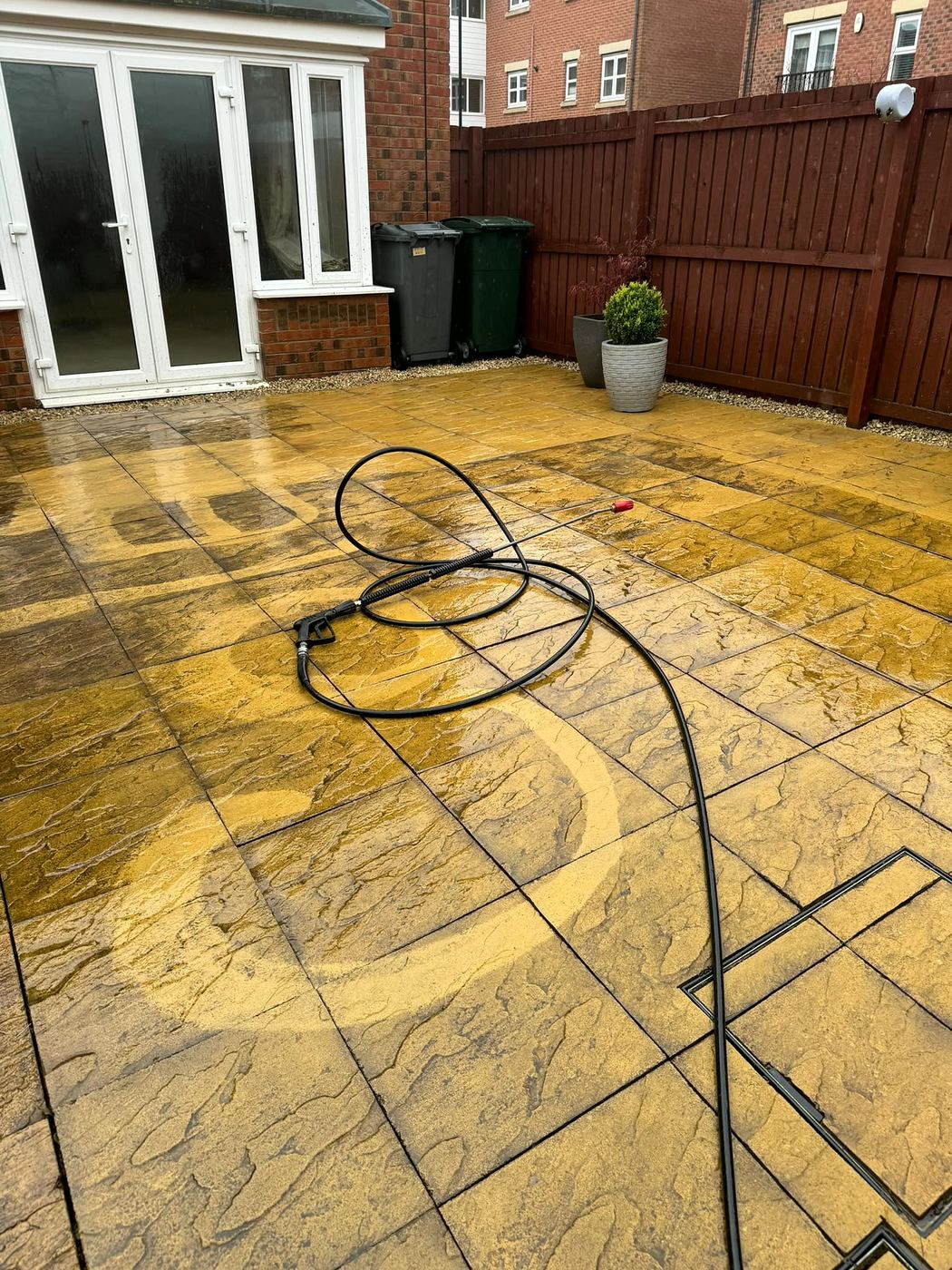 Patio part-way through a jet wash