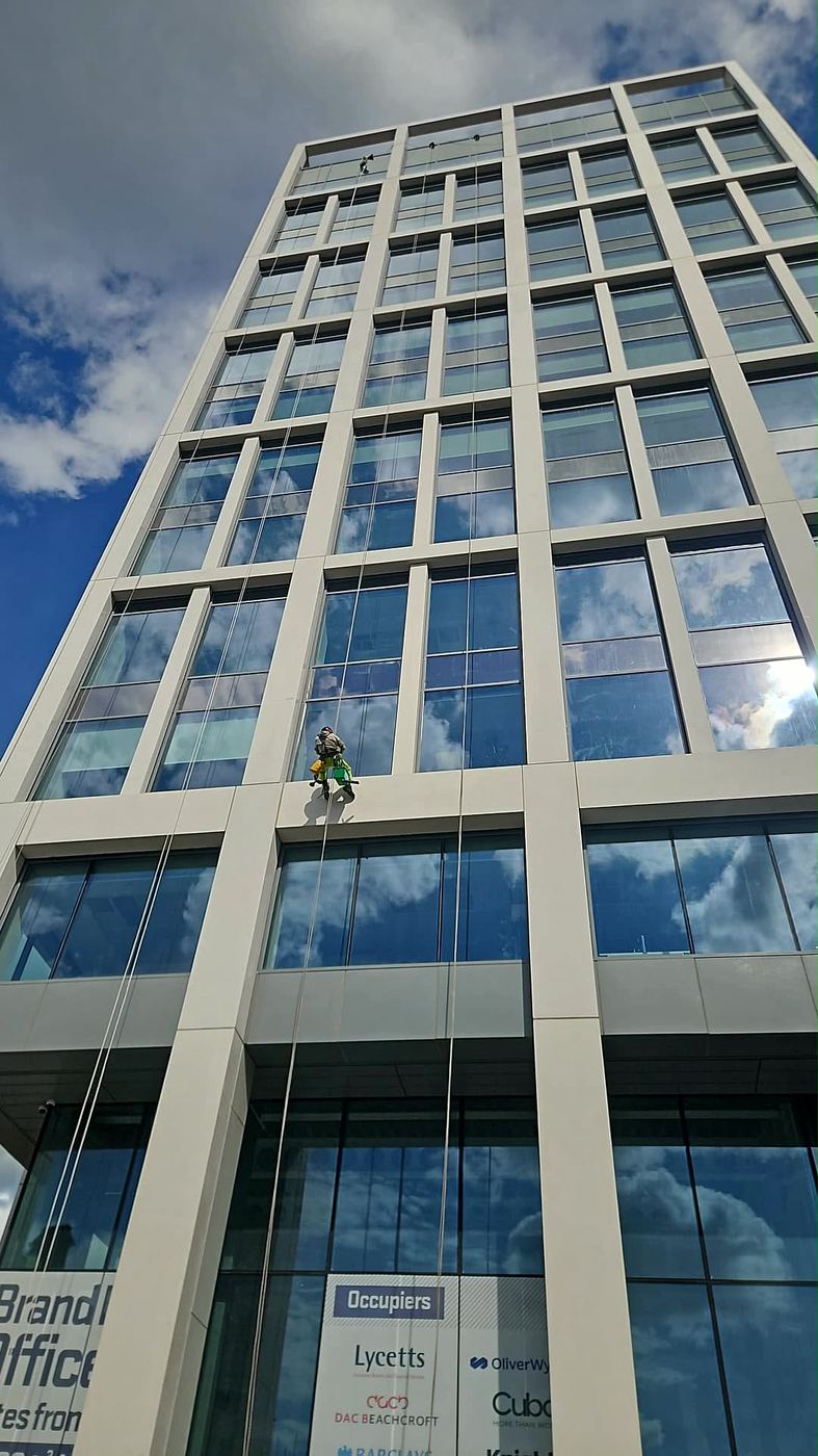 Rope access window cleaner on a high-rise office tower